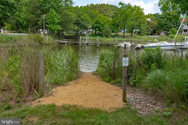 a view of a lake with sitting area