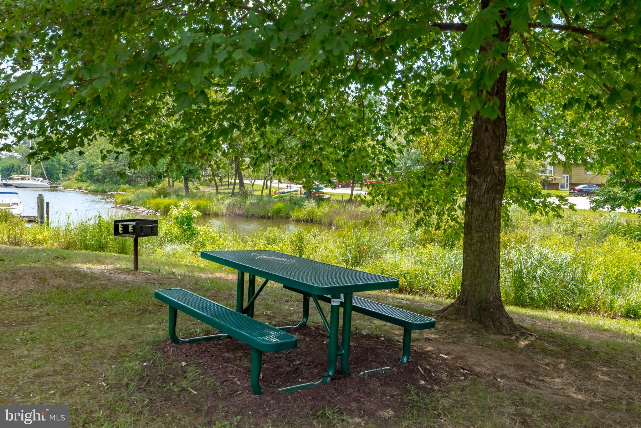 1505 Grange Road Edgewater, MD 21037 - Photo 43 of 45 a view of a bench in a backyard