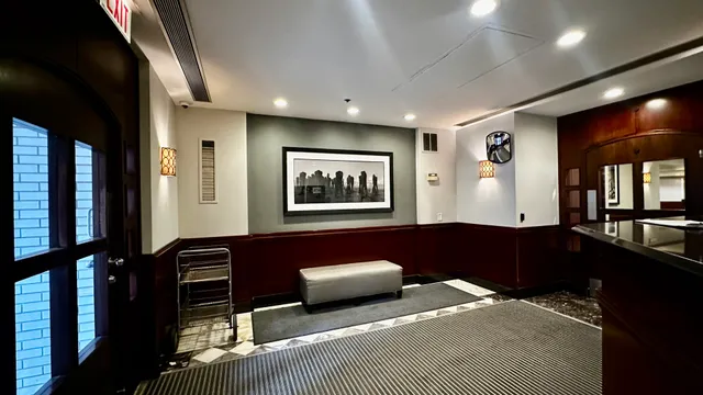 a bedroom with a bed and glass door