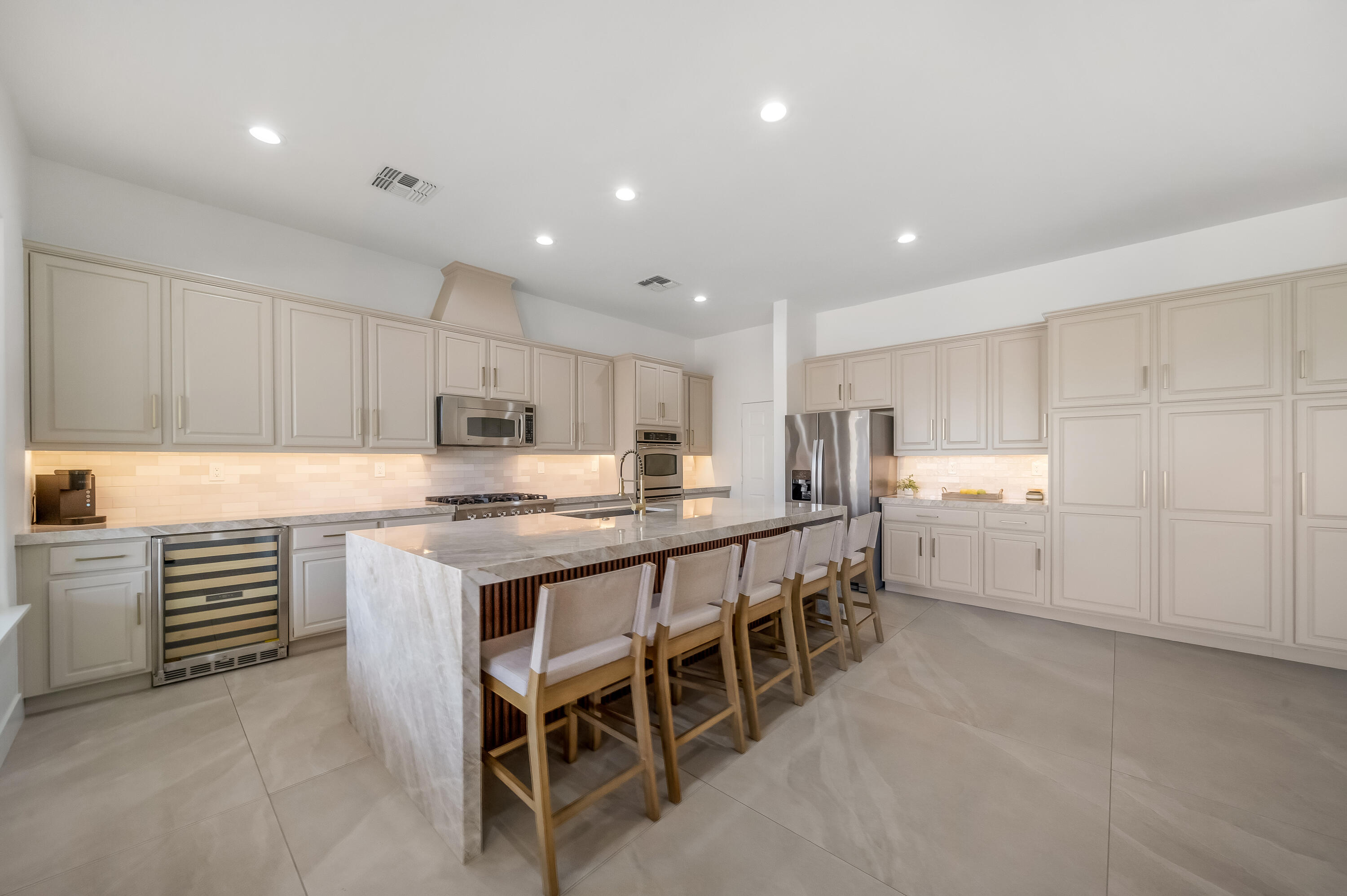 80262 Amazon Avenue Indio, CA 92201 - Photo 14 of 69 a kitchen with white cabinets and white appliances