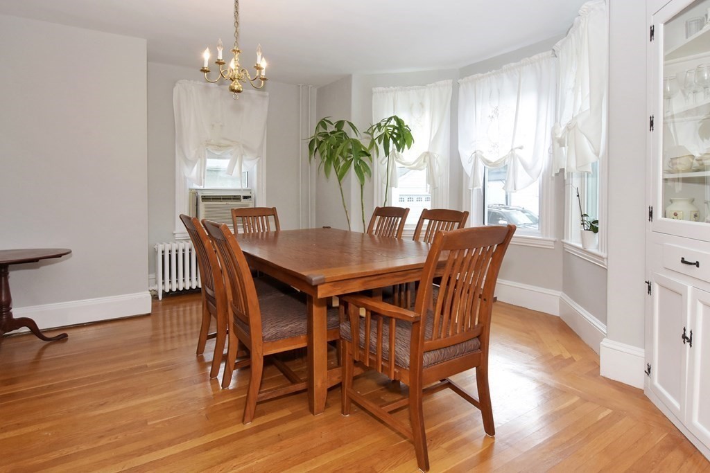 18 High Street Saugus, MA 01906 - Photo 12 of 35 a view of a dining room with furniture window and wooden floor
