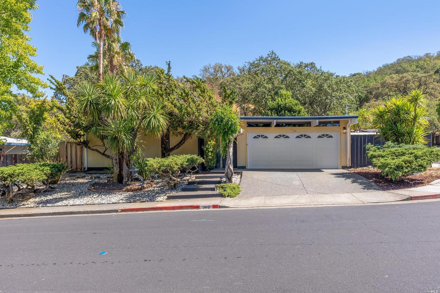 front view of a house with a street