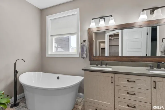 a kitchen with stainless steel appliances a sink stove and cabinets