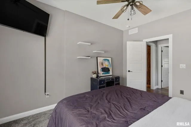 a bed room with a bed and a window