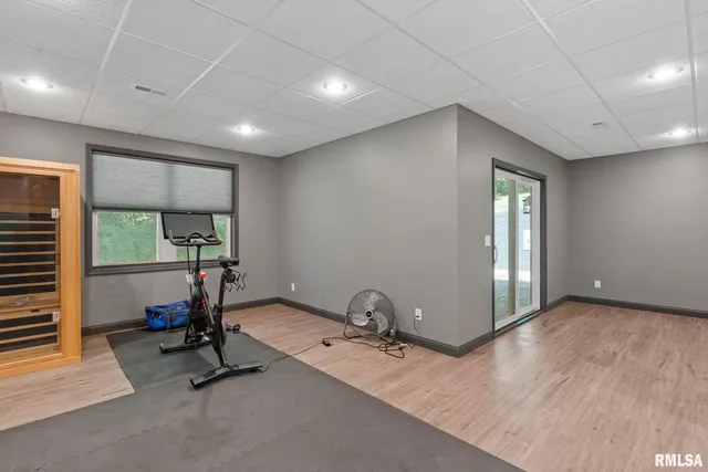 a view of a deck with a wooden floor and fence