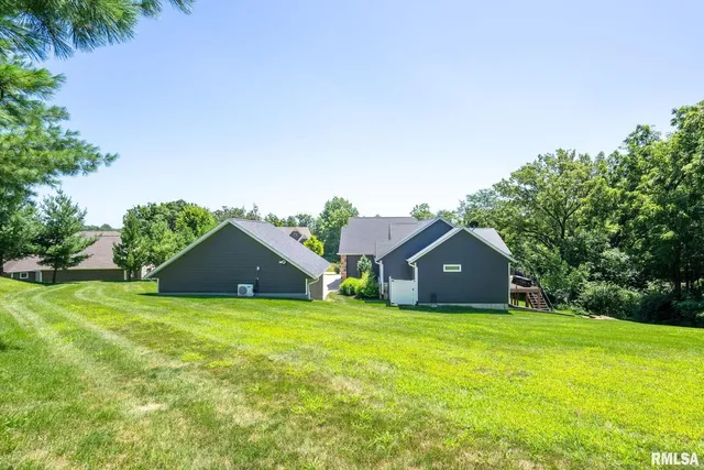 an aerial view of a houses with a yard