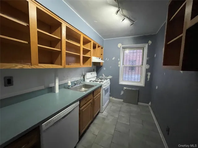 a kitchen with a sink and a window