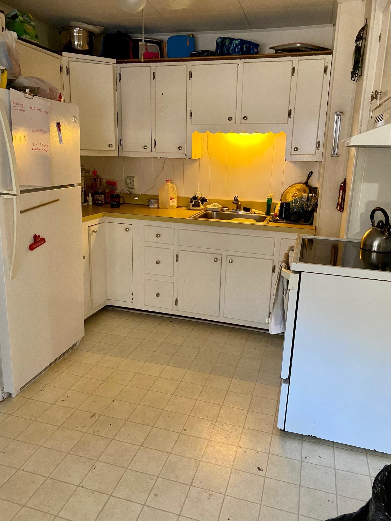 180 Perry Road Woodbine, NJ 08270 - Photo 4 of 6 a kitchen with stainless steel appliances a stove a sink and a refrigerator