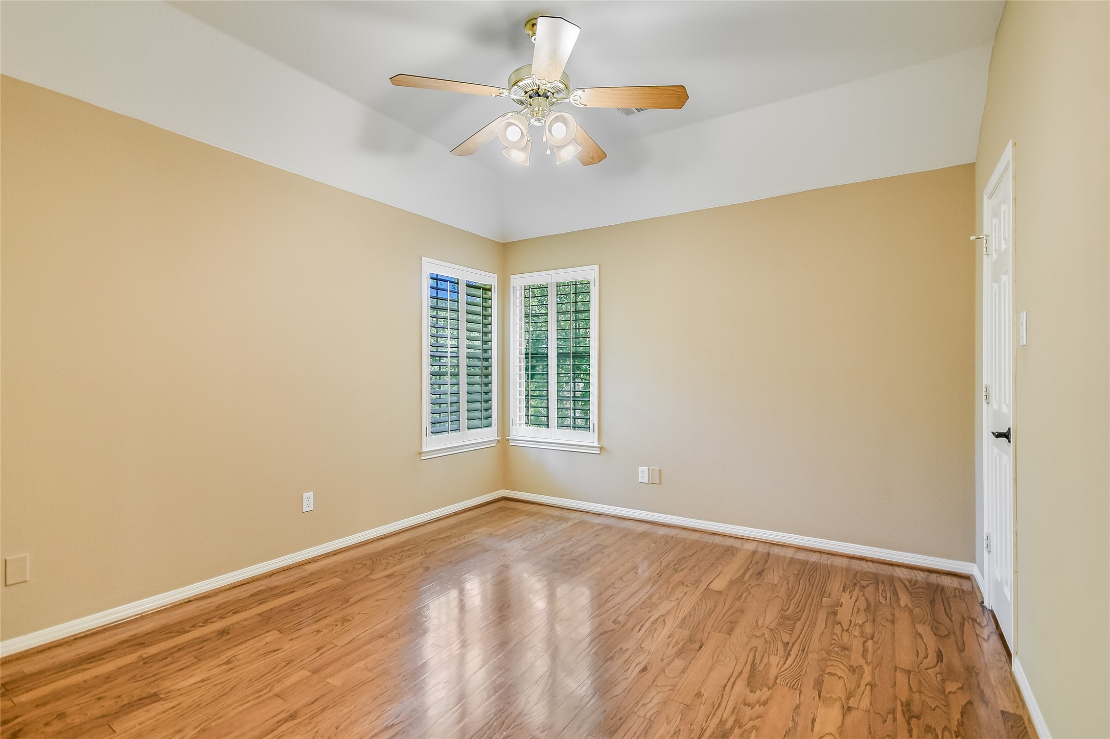12935 Brigham Drive Austin, TX 78732 - Photo 26 of 35 Bedroom 3 - has a walk-in closet and has backyard views.