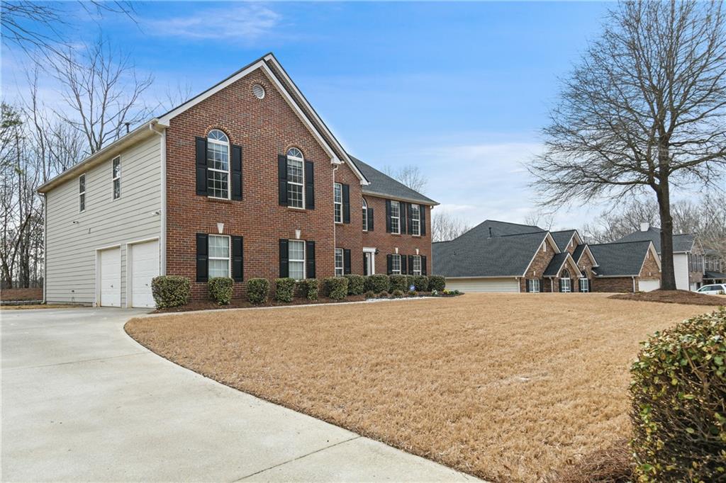 4653 Mayer Trace Ellenwood, GA 30294 - Photo 1 of 1 a front view of a house with a yard