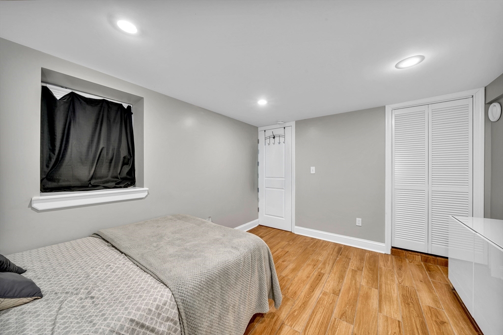 144 Orvis Road Revere, MA 02151 - Photo 21 of 42 a bedroom with a bed and a window