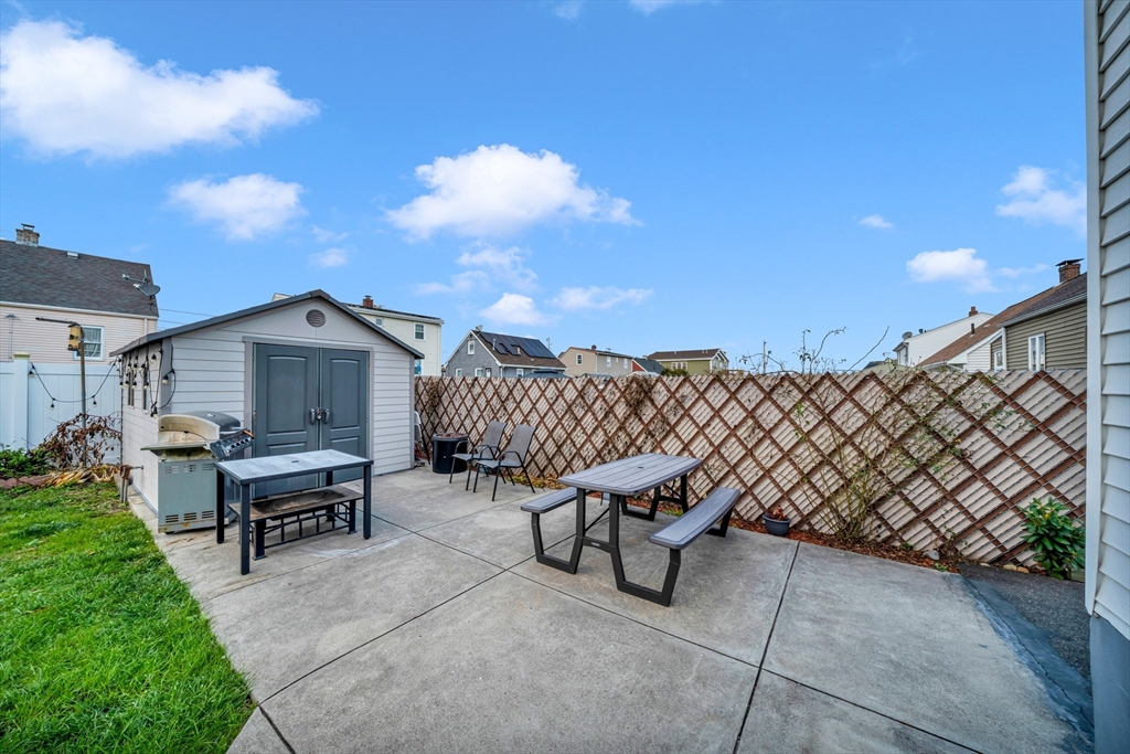 144 Orvis Road Revere, MA 02151 - Photo 37 of 42 a roof deck with table and chairs