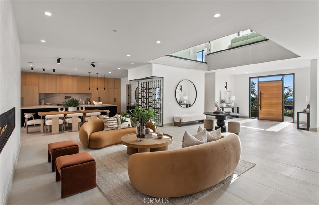 1210 Kings Road Newport Beach, CA 92663 - Photo 12 of 50 a living room with furniture and a large window