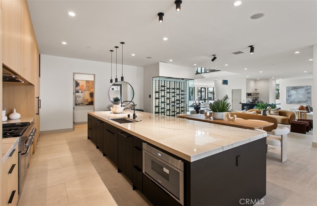 1210 Kings Road Newport Beach, CA 92663 - Photo 15 of 50 a large kitchen with stainless steel appliances a stove a sink a oven and a refrigerator