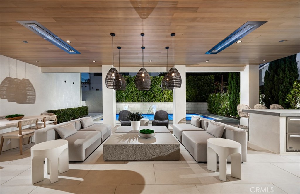 1210 Kings Road Newport Beach, CA 92663 - Photo 17 of 50 a living room with furniture and a large window