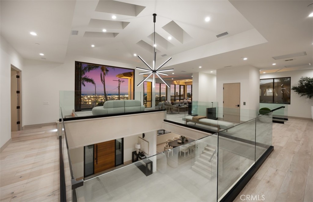 1210 Kings Road Newport Beach, CA 92663 - Photo 20 of 50 a view of living room kitchen with stainless steel appliances granite countertop center island and stove