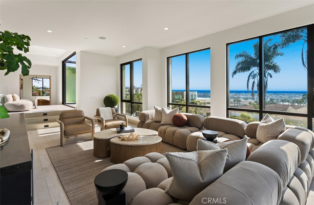 1210 Kings Road Newport Beach, CA 92663 - Photo 25 of 50 a living room with furniture and a large window