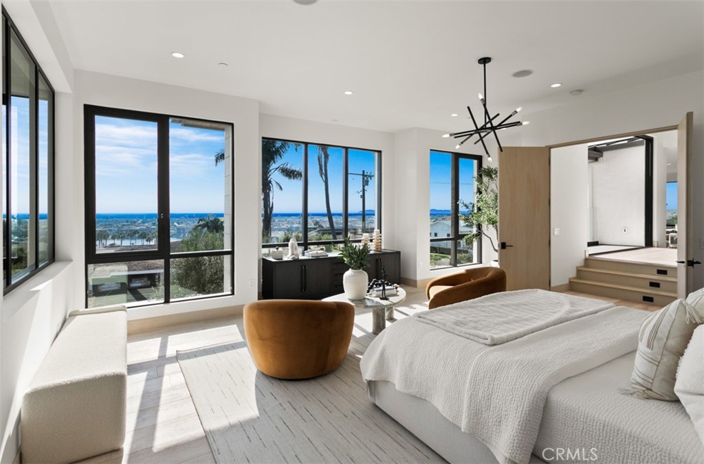 1210 Kings Road Newport Beach, CA 92663 - Photo 26 of 50 a bedroom with a bed and large windows