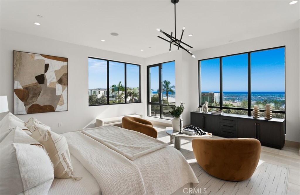 1210 Kings Road Newport Beach, CA 92663 - Photo 27 of 50 a bedroom with a large bed and a large window