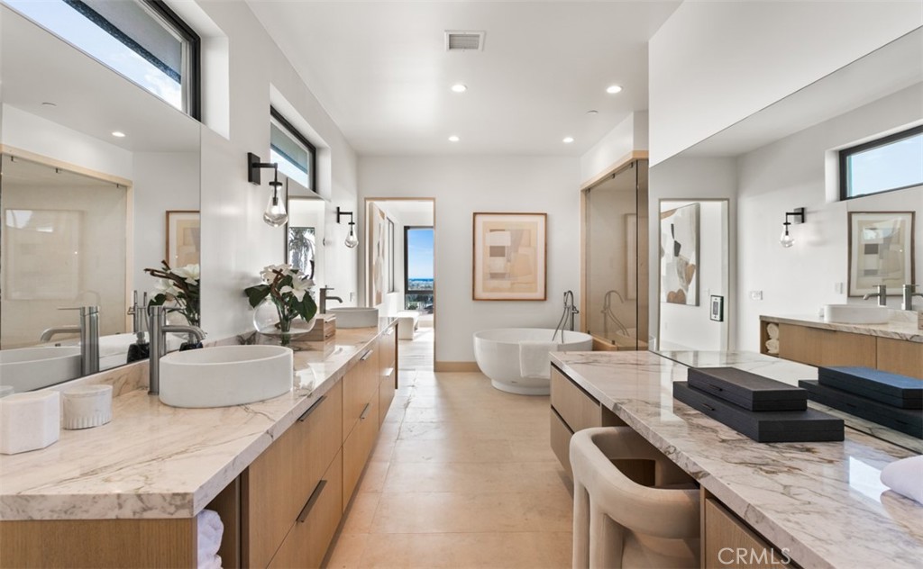 1210 Kings Road Newport Beach, CA 92663 - Photo 32 of 50 a large kitchen with a counter top space a sink stainless steel appliances and cabinets