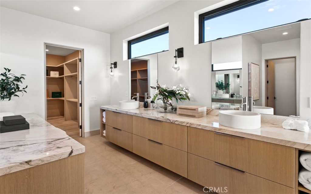 1210 Kings Road Newport Beach, CA 92663 - Photo 33 of 50 a bathroom with a sink and a mirror