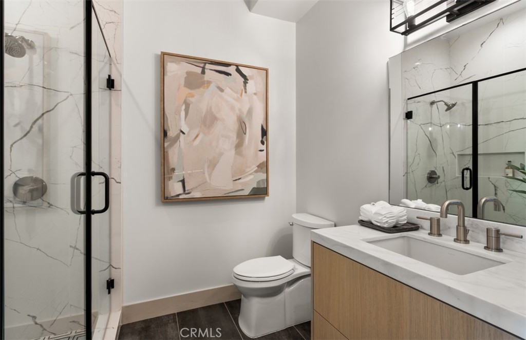 1210 Kings Road Newport Beach, CA 92663 - Photo 41 of 50 a bathroom with a granite countertop sink mirror vanity and toilet