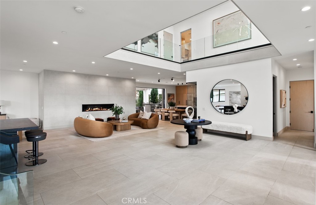 1210 Kings Road Newport Beach, CA 92663 - Photo 6 of 50 a gym room with furniture and a mirror