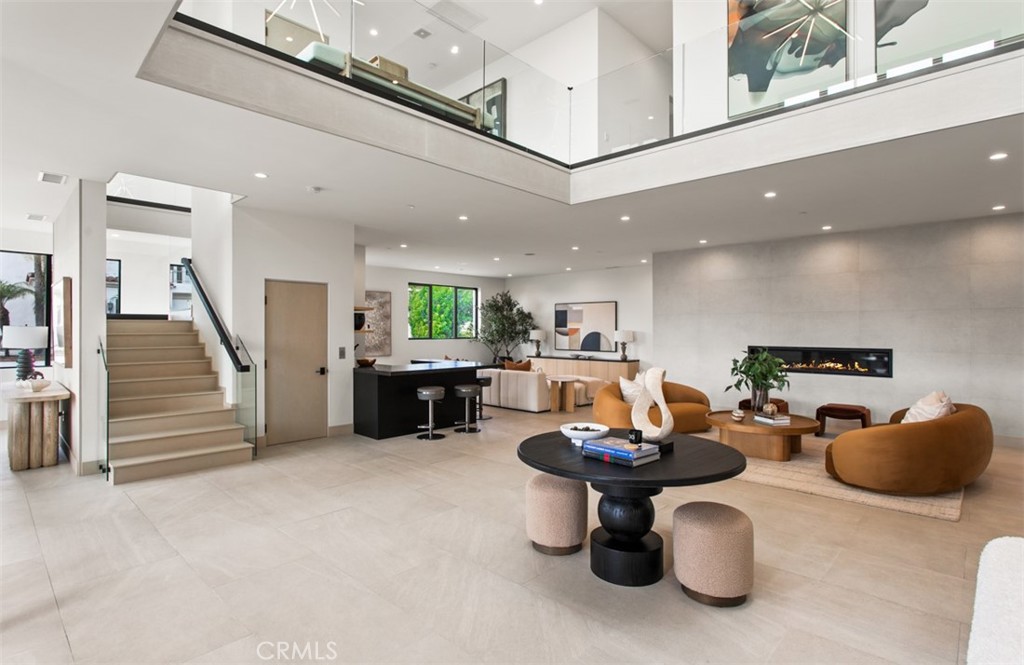 1210 Kings Road Newport Beach, CA 92663 - Photo 7 of 50 a living room with furniture a red rug and kitchen view
