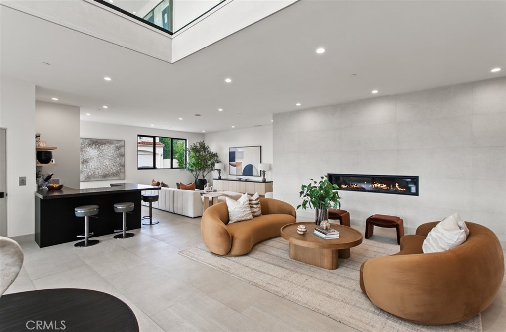 1210 Kings Road Newport Beach, CA 92663 - Photo 8 of 50 a living room with furniture kitchen view and a chandelier