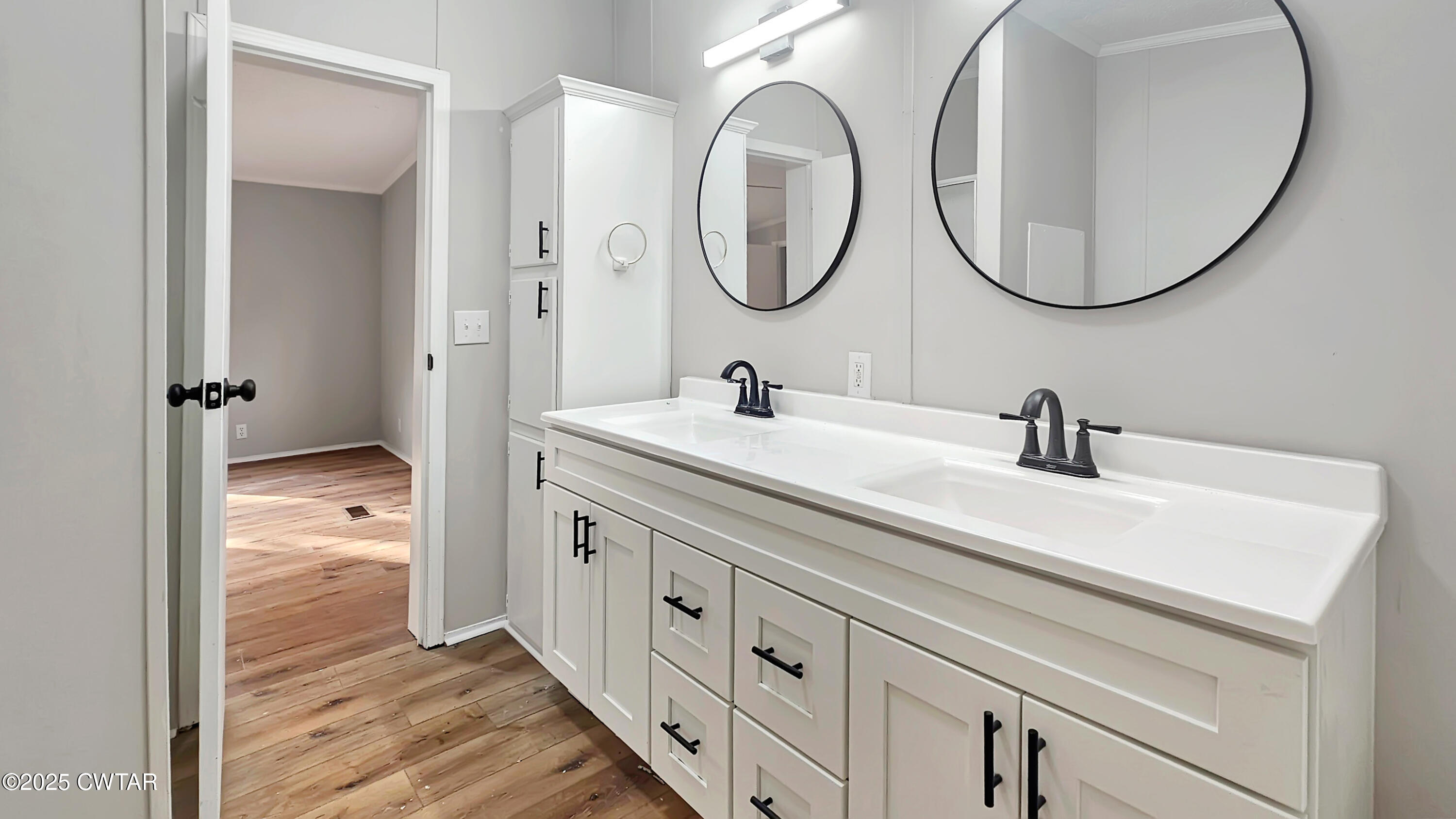 5427 Shades Bridge Road McKenzie, TN 38201 - Photo 12 of 35 a en suite bathroom with a double vanity sink and a mirror