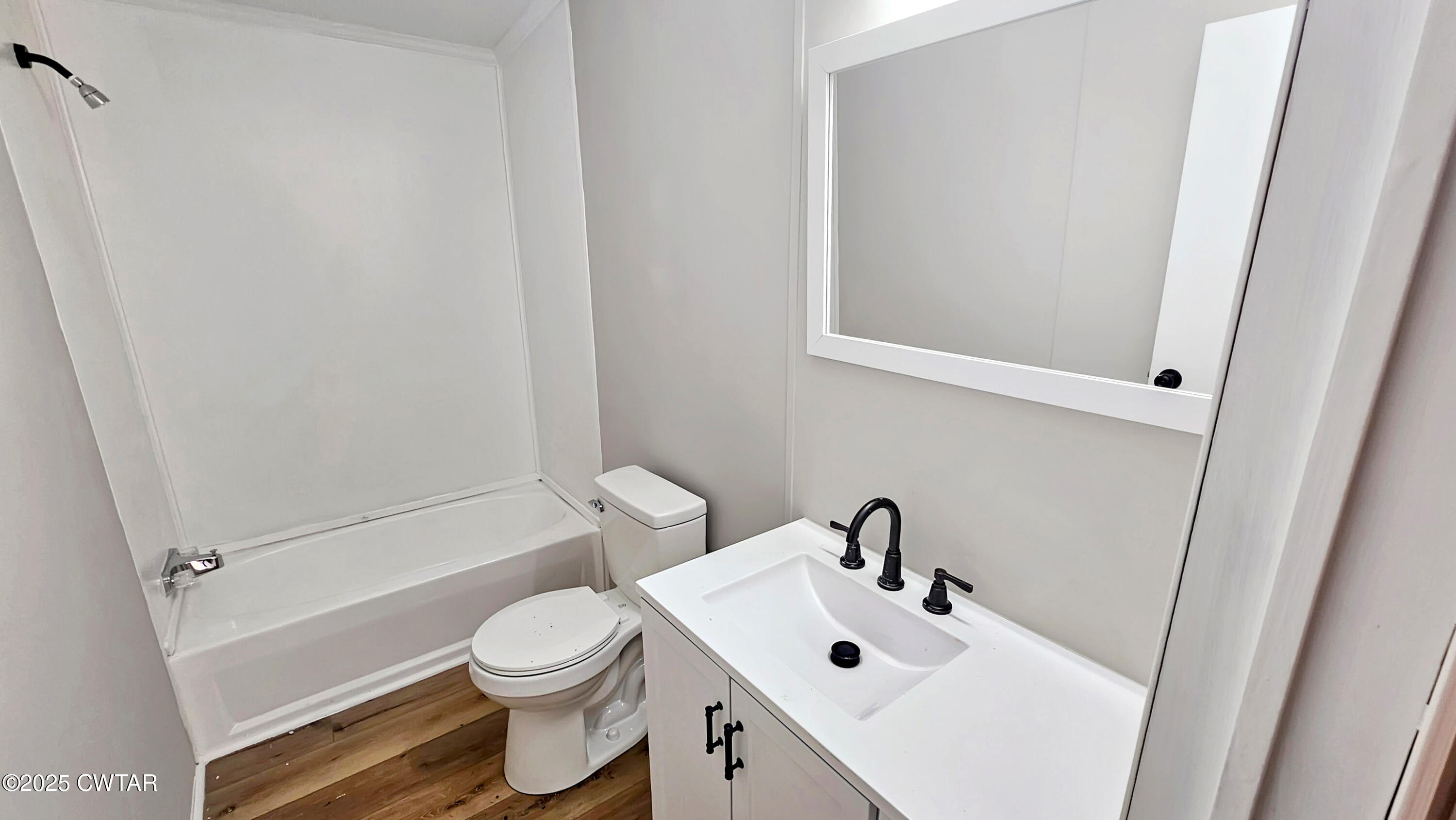5427 Shades Bridge Road McKenzie, TN 38201 - Photo 18 of 35 a white toilet sitting next to a bathroom sink