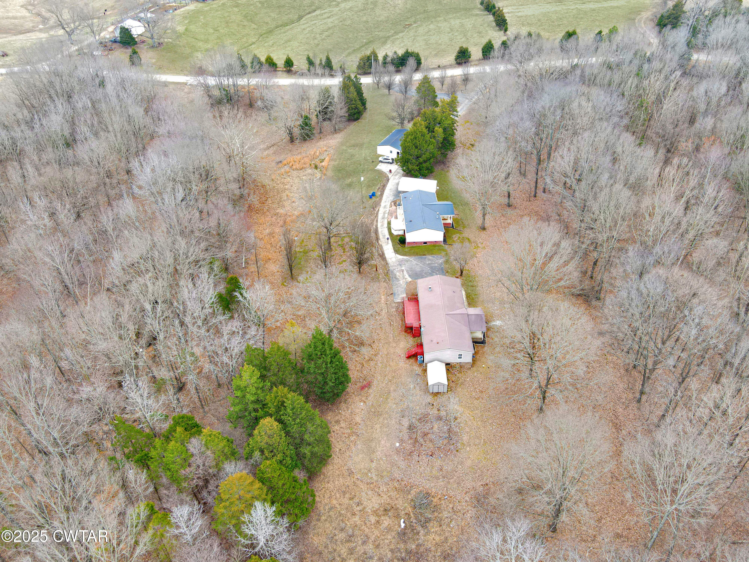 5427 Shades Bridge Road McKenzie, TN 38201 - Photo 2 of 35 an aerial view of residential houses with outdoor space