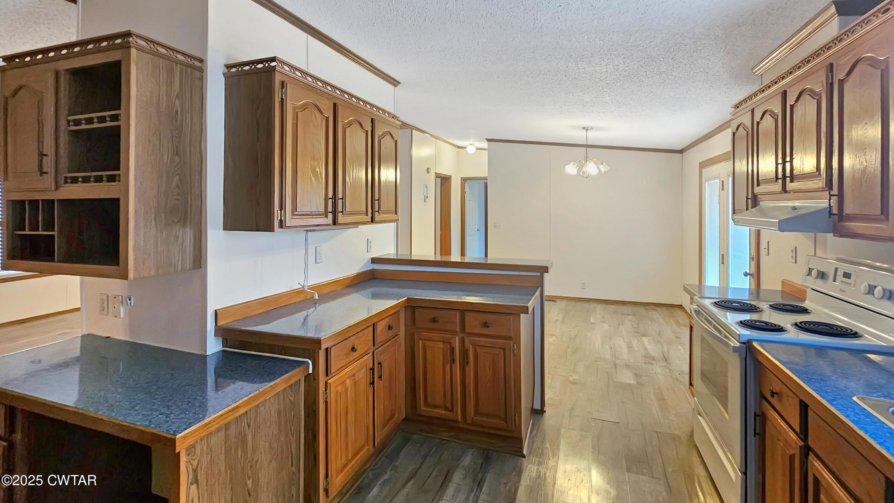 5427 Shades Bridge Road McKenzie, TN 38201 - Photo 23 of 35 a kitchen that has a sink and a stove in it