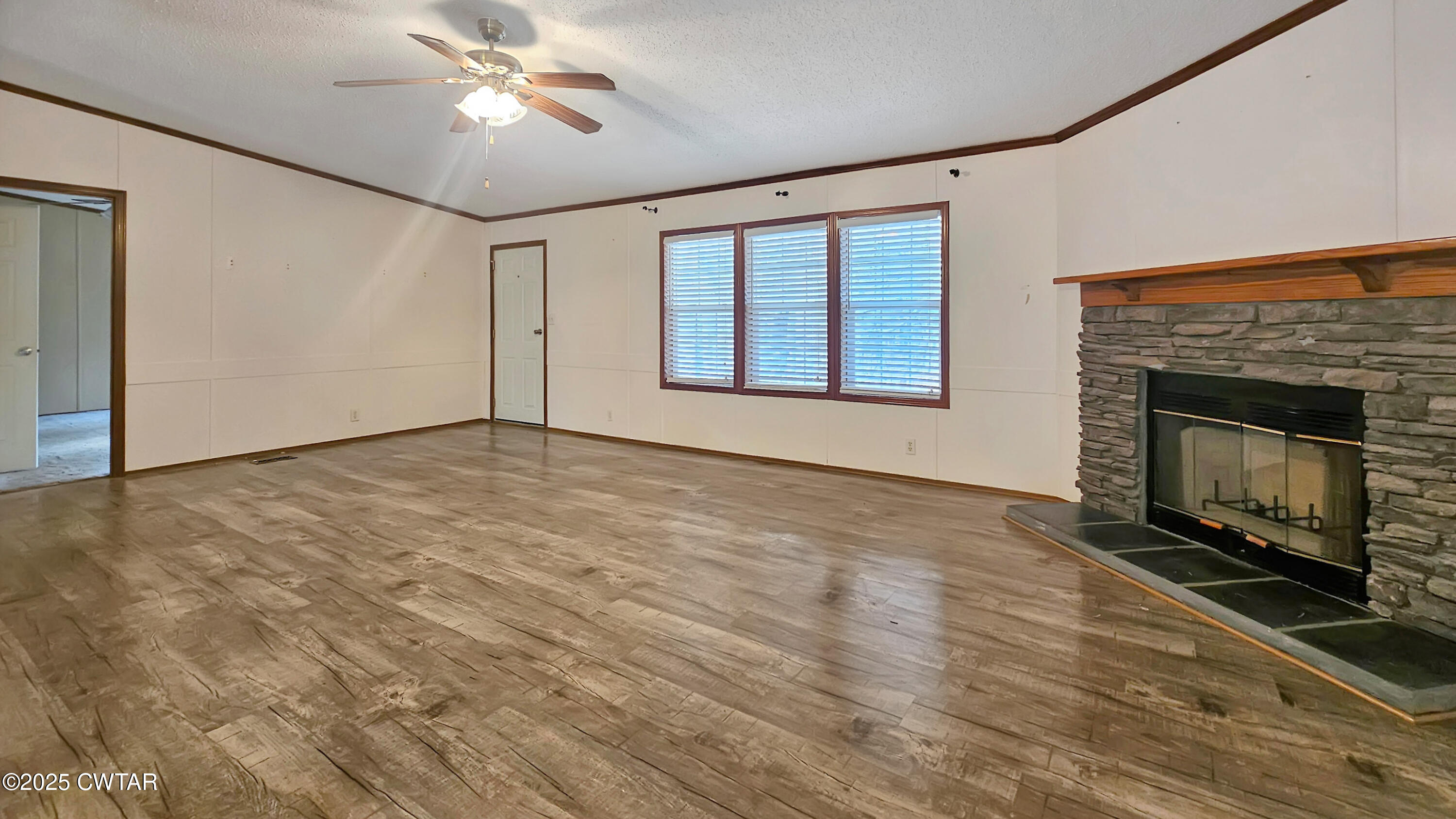 5427 Shades Bridge Road McKenzie, TN 38201 - Photo 25 of 35 a view of an empty room with a fireplace and a window