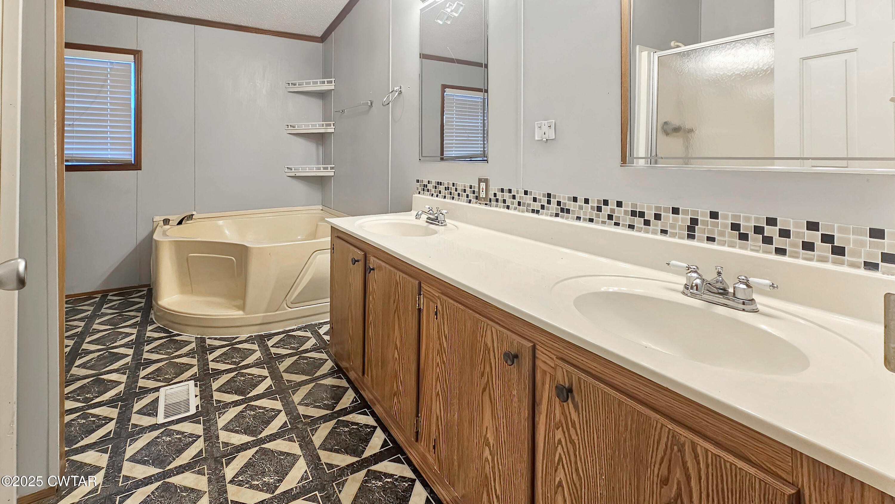 5427 Shades Bridge Road McKenzie, TN 38201 - Photo 27 of 35 a bathroom with a sink and a mirror