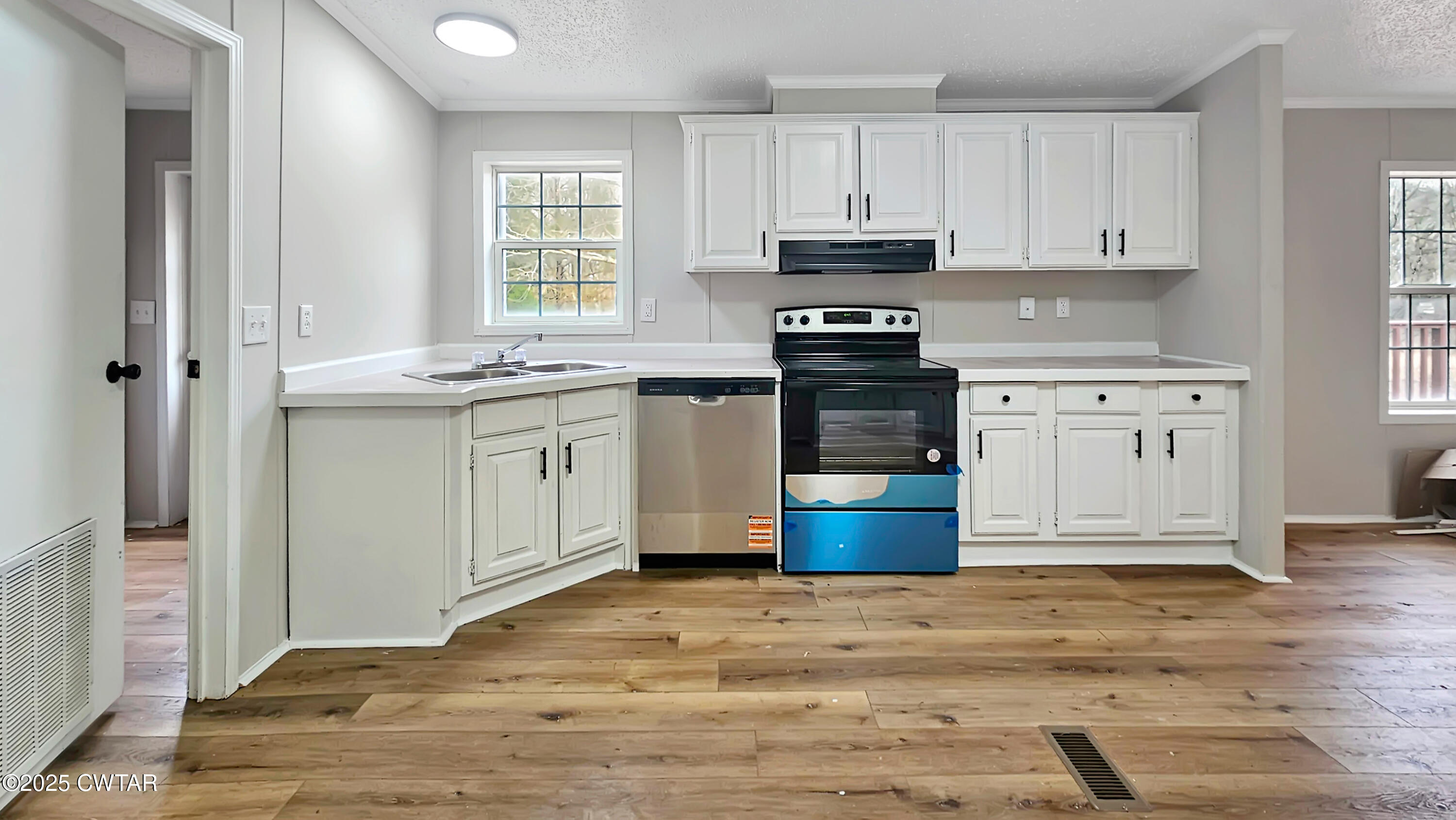 5427 Shades Bridge Road McKenzie, TN 38201 - Photo 9 of 35 a kitchen with stainless steel appliances granite countertop a stove a sink and a refrigerator