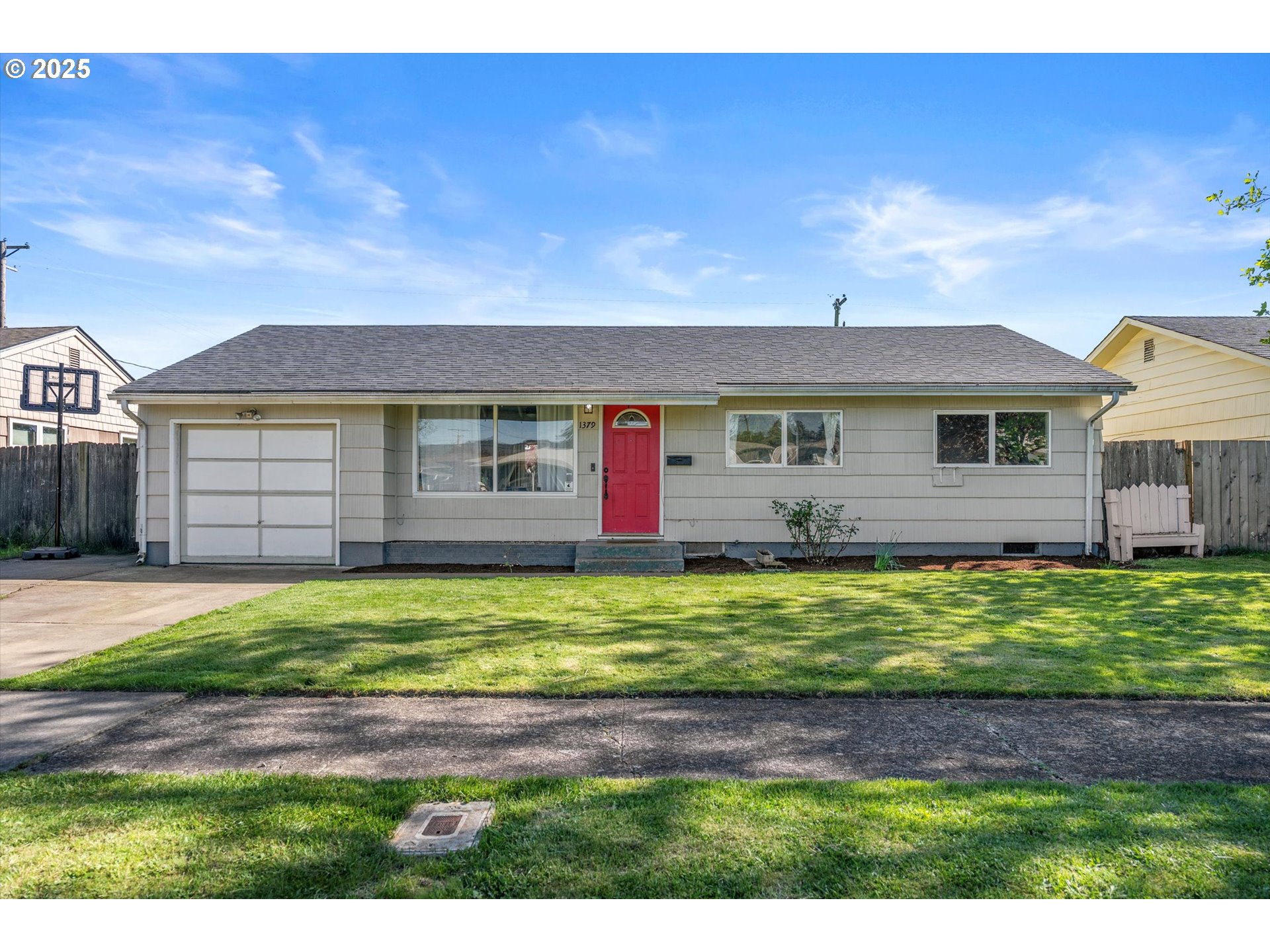 1379 Olympic Street Springfield, OR 97477 - Photo 1 of 33 a front view of a house with a garden