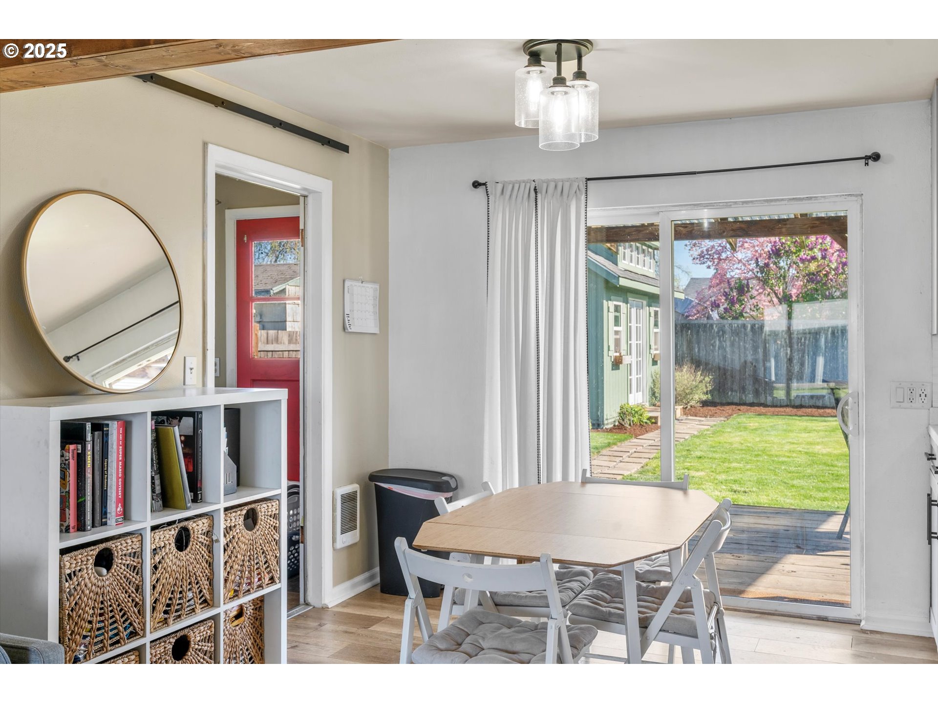 1379 Olympic Street Springfield, OR 97477 - Photo 11 of 33 a dining room with furniture a window and a wooden floor
