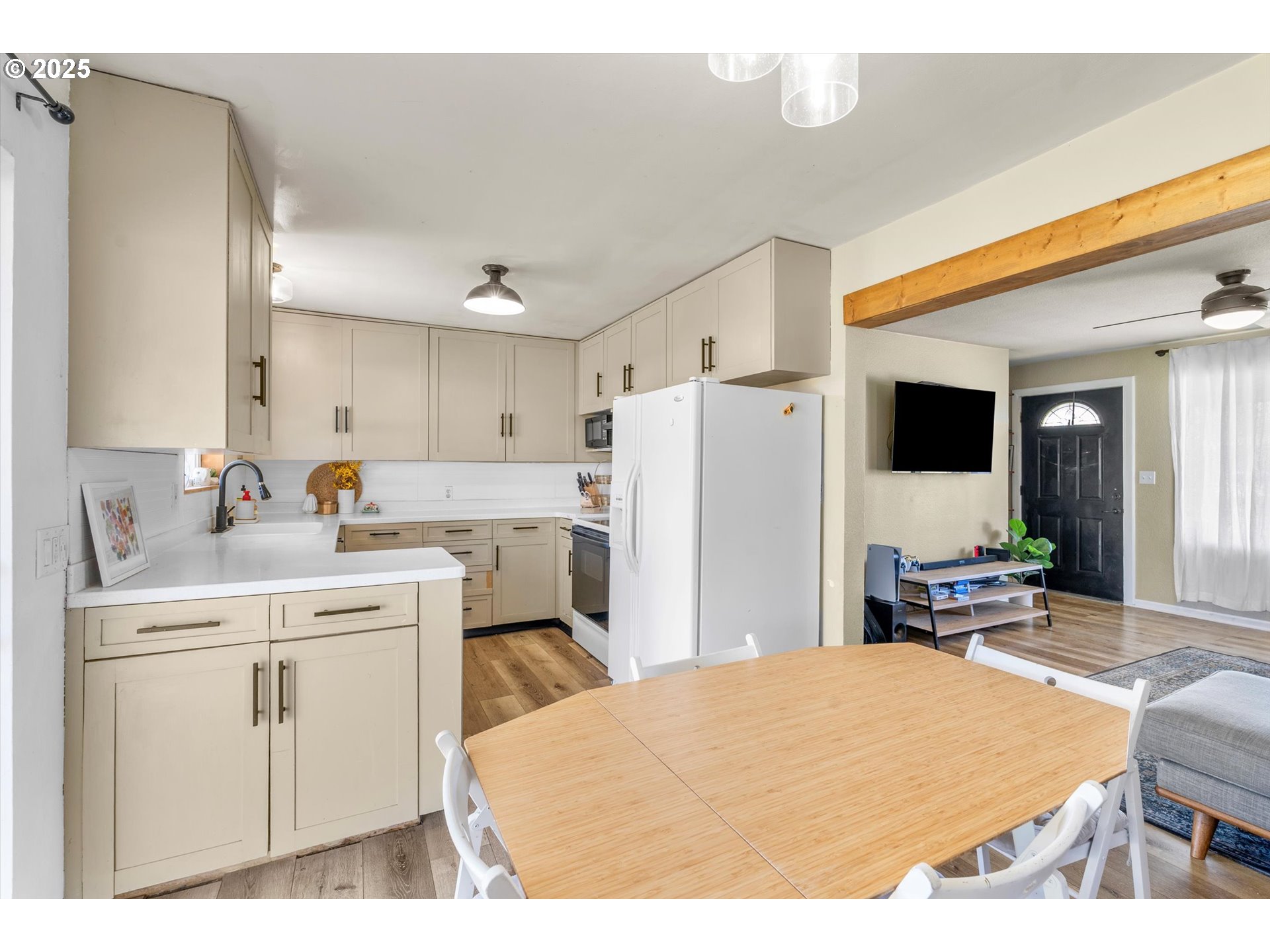 1379 Olympic Street Springfield, OR 97477 - Photo 13 of 33 a kitchen with a sink a stove a refrigerator and cabinets