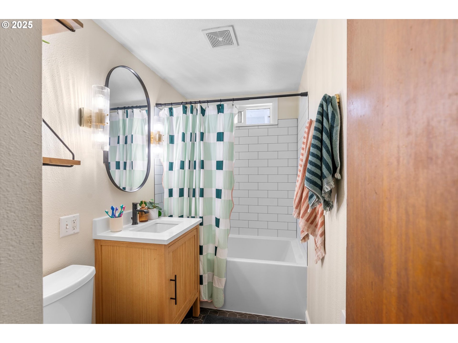 1379 Olympic Street Springfield, OR 97477 - Photo 16 of 33 a bathroom with a sink a toilet and a mirror