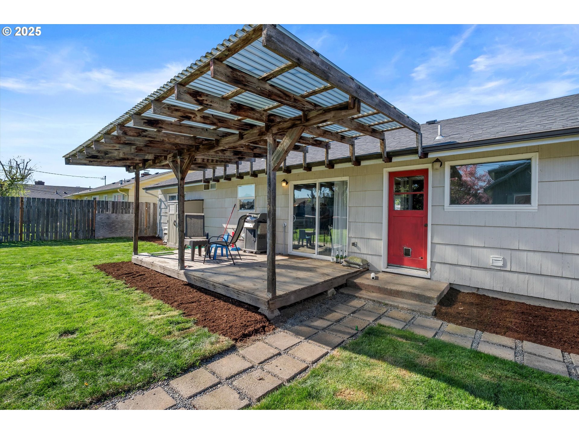 1379 Olympic Street Springfield, OR 97477 - Photo 24 of 33 a view of a house with backyard porch and sitting area