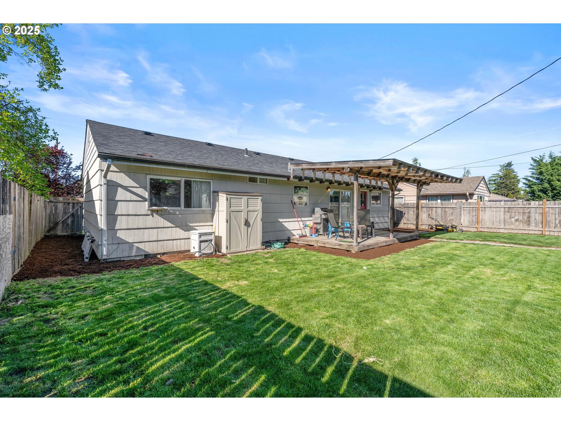 1379 Olympic Street Springfield, OR 97477 - Photo 29 of 33 a front view of a house with a garden and outdoor seating