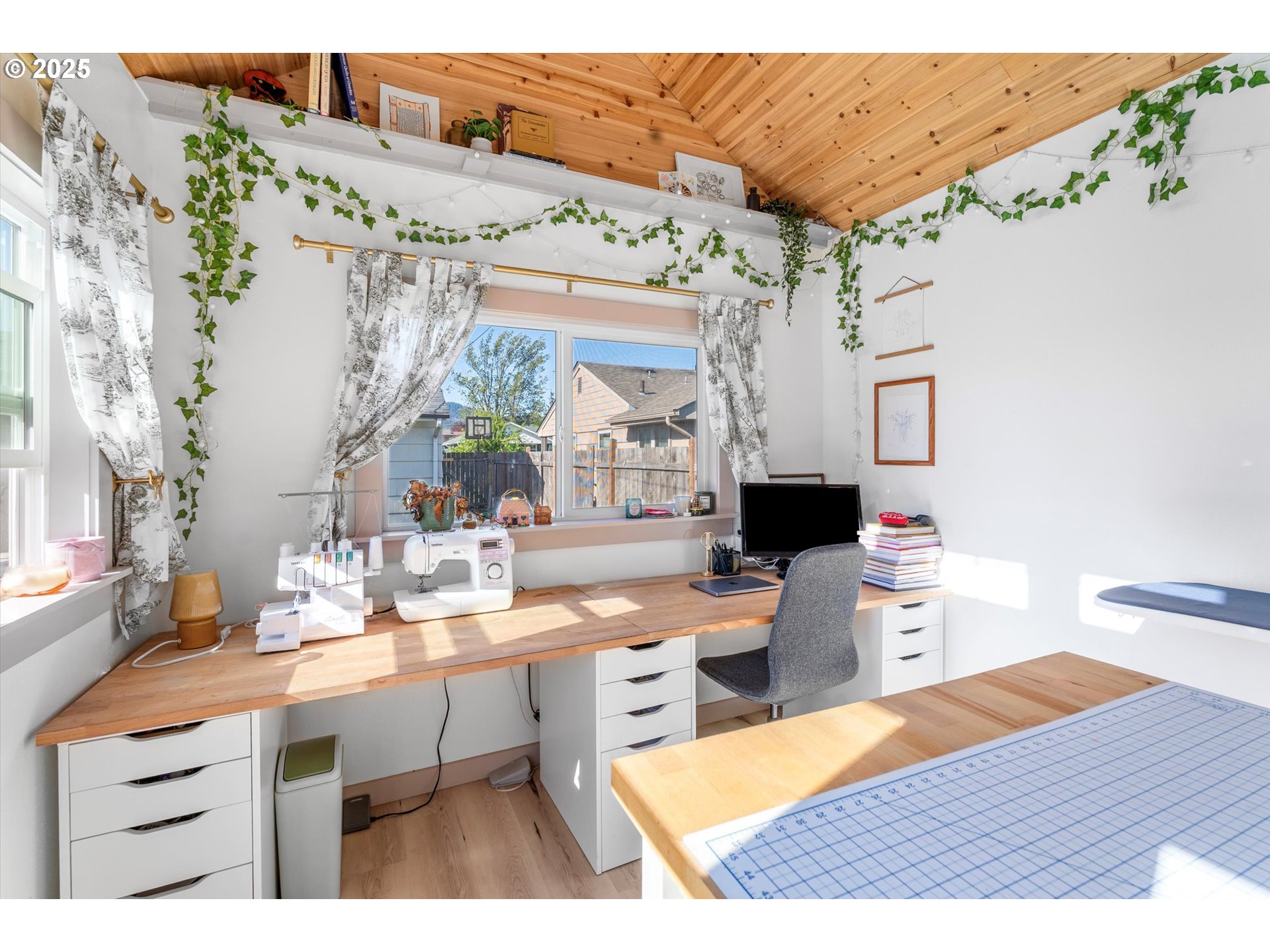 1379 Olympic Street Springfield, OR 97477 - Photo 31 of 33 a room with furniture a flat screen tv and a table