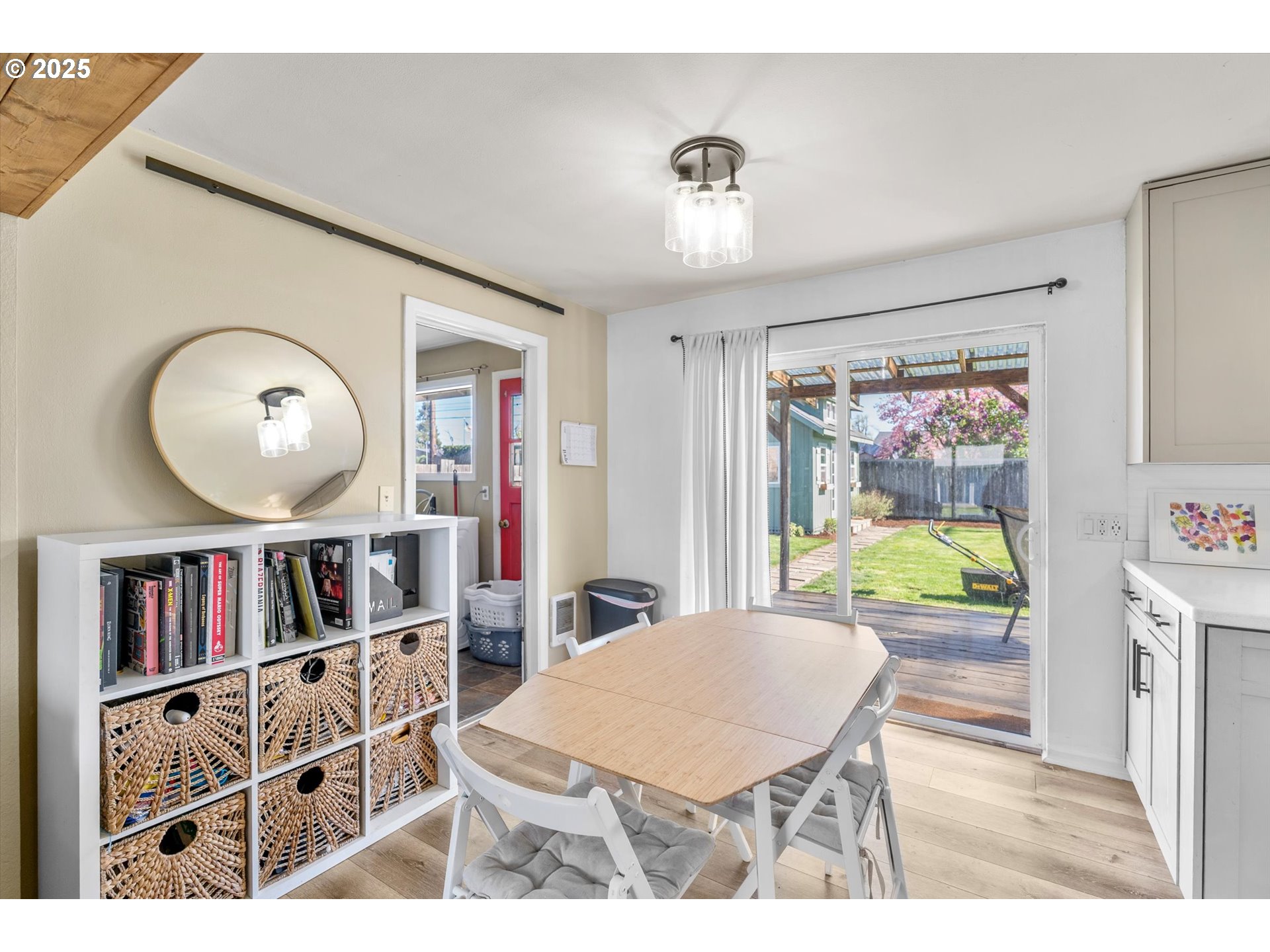 1379 Olympic Street Springfield, OR 97477 - Photo 6 of 33 a living room with furniture a rug and a bookshelf