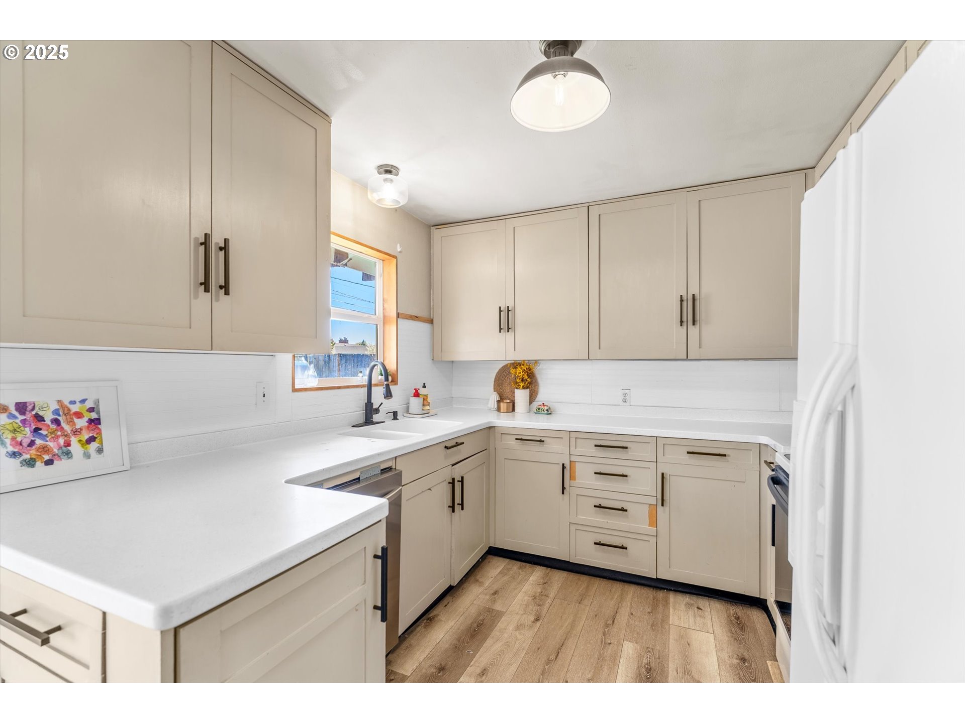 1379 Olympic Street Springfield, OR 97477 - Photo 7 of 33 a kitchen with a sink cabinets and window
