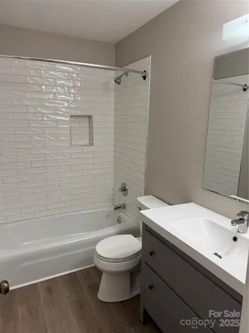 a bathroom with a toilet a sink and a bathtub