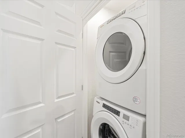 an empty room with closet and a bathroom