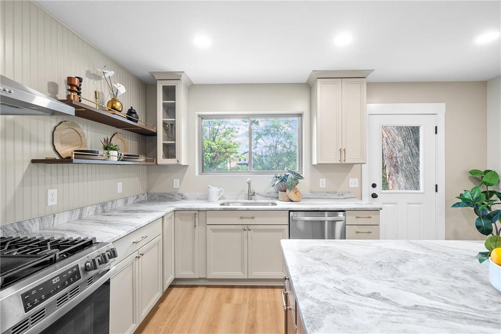 1431 Adams Street Pittsburgh, PA 15233 - Photo 12 of 42 a kitchen with a sink stove and cabinets