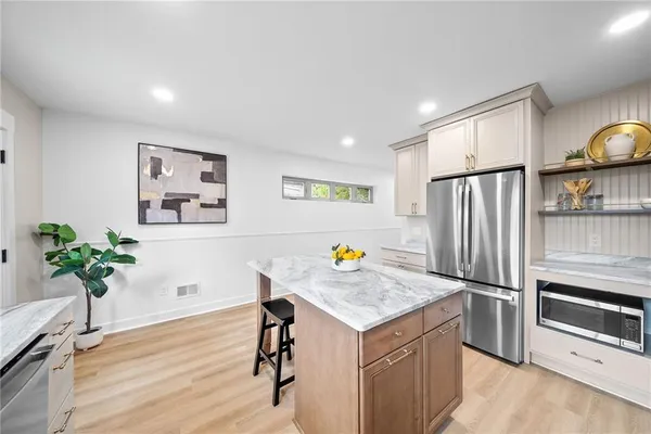 a view of kitchen with furniture and wooden floor