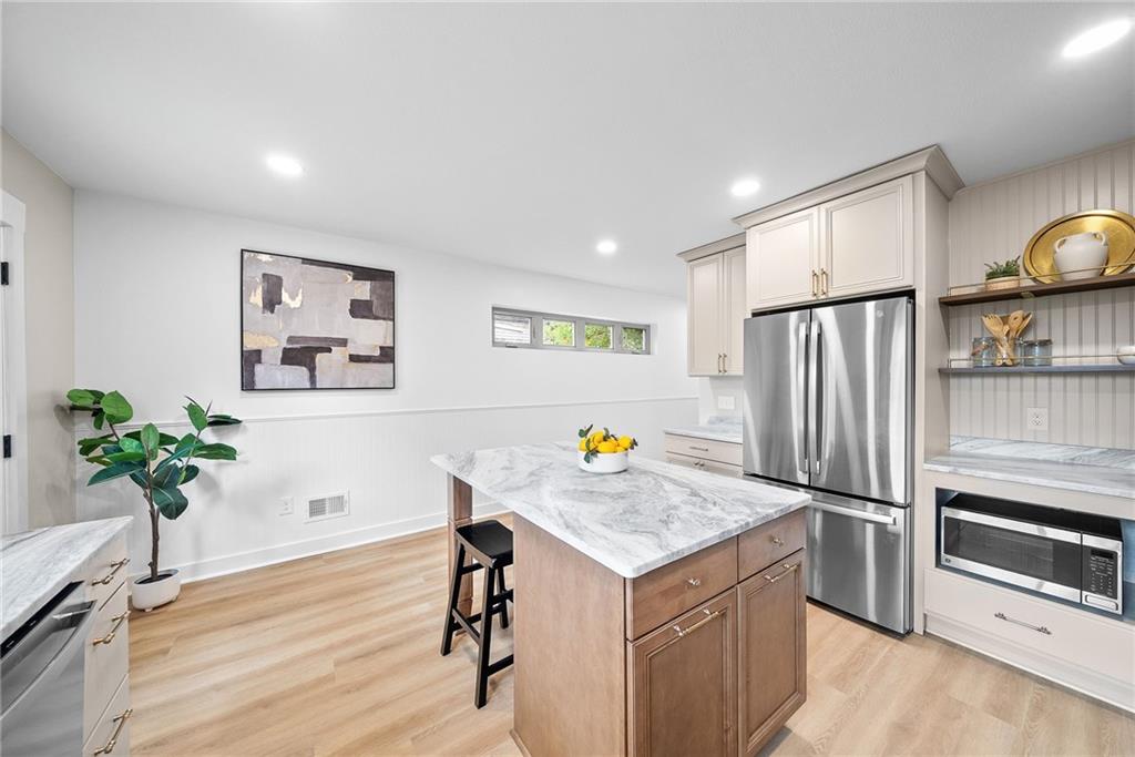 1431 Adams Street Pittsburgh, PA 15233 - Photo 14 of 42 a view of kitchen with furniture and wooden floor